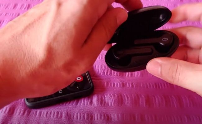 Taotronics Earbuds In Their Charging Case