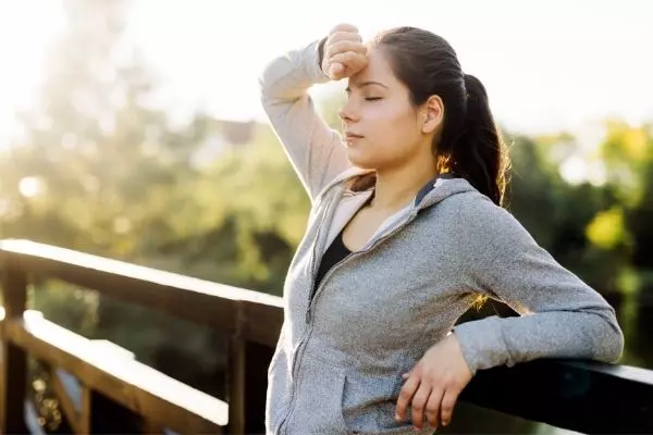 An Image Of A Girl Stressed Out Due To Workout.