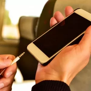 Plugging A Headphone On A Smartphone